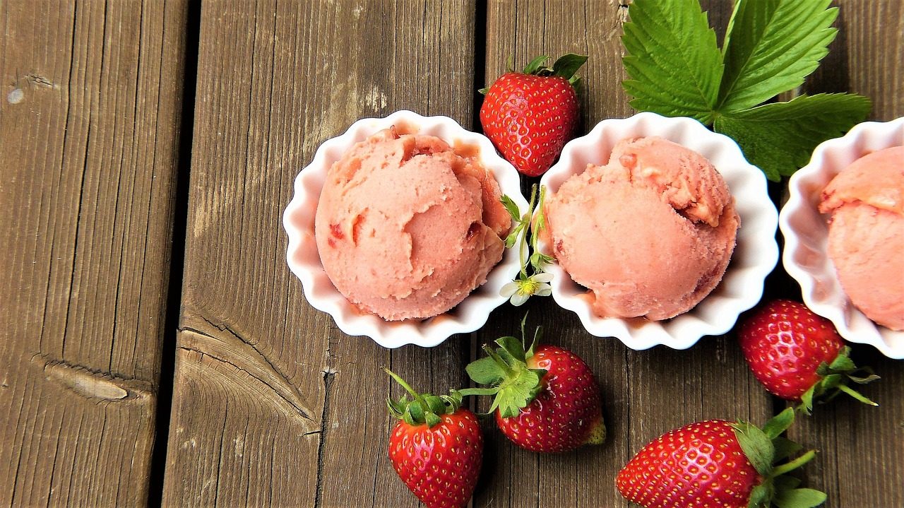 Free stock photo of strawberry ice cream scoops on a wooden table